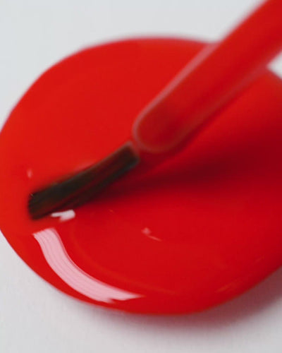 bright red nail polish drop by sienna