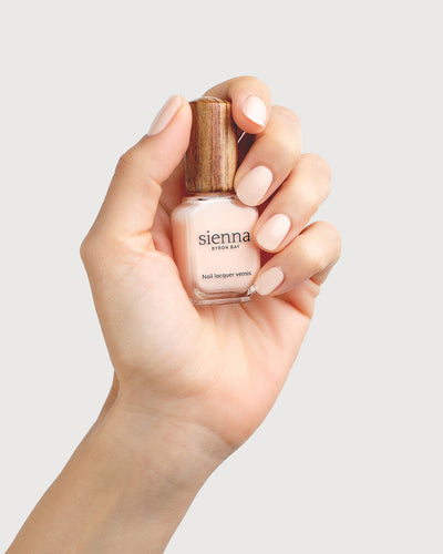 Nude Light Peach Nail Polish on Fair Skin Tone with Sienna Bottle