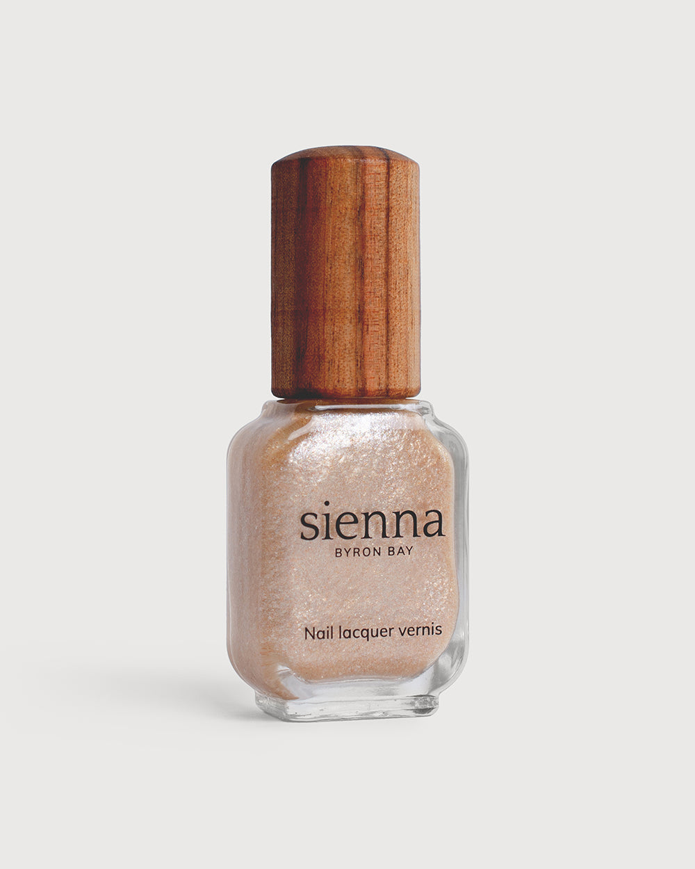 Grapefruit Granita Crystal nail polish in bottle with timber cap