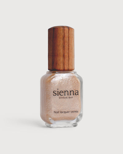 Grapefruit Granita Crystal nail polish in bottle with timber cap