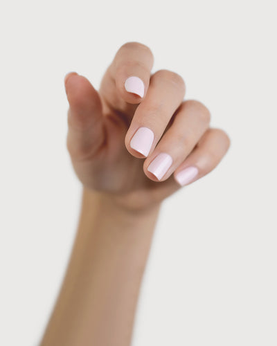 misty lilac nail polish hand swatch on fair skin tone
