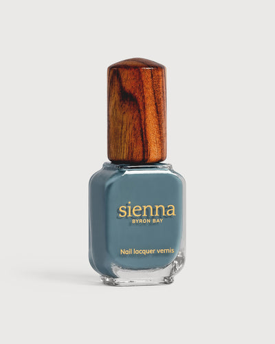 Mid grey-blue nail polish glass bottle with timber cap