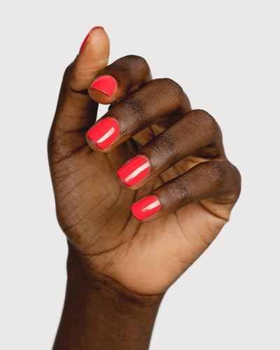 barbie pink nail polish hand swatch on dark skin tone