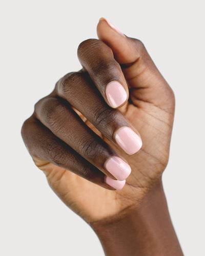 Shimmering Cherry Blossom Nail Polish on Dark Skin Tone