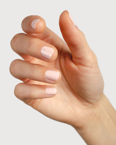 rosewater pink nail polish hand swatch on fair skin tone