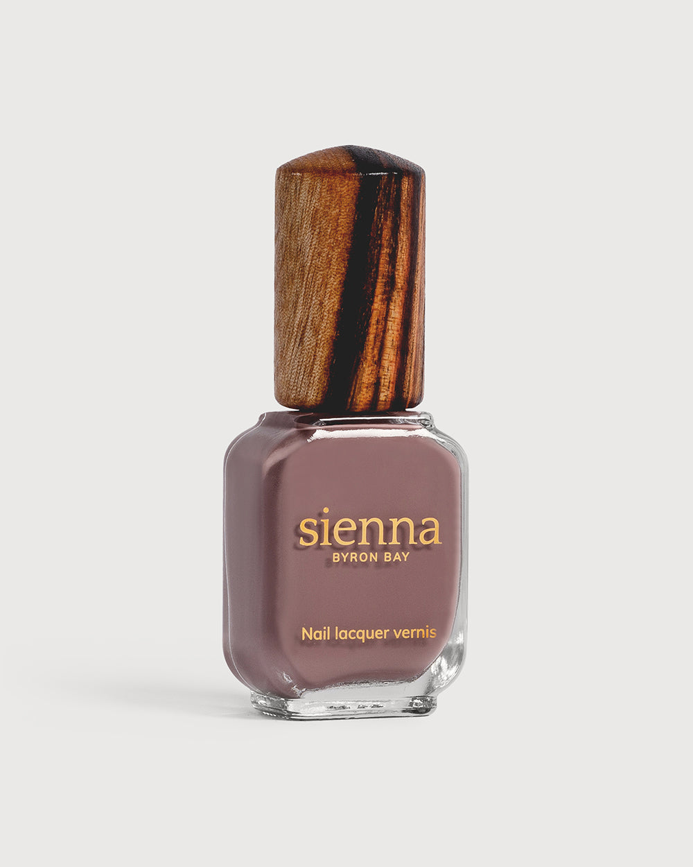 dusty mauve nail polish glass bottle with timber cap