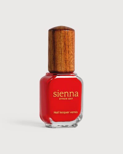 bright red nail polish glass bottle with timber cap