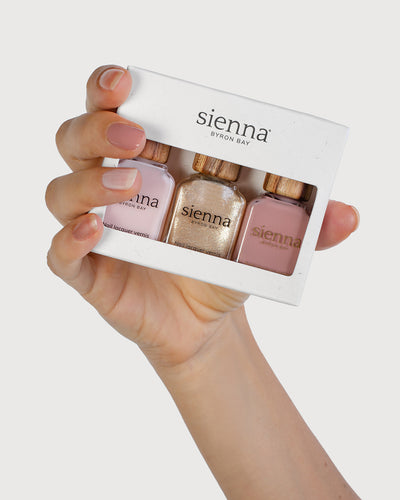 Fair Skin Tone Hand holding the Essence Trio Pack