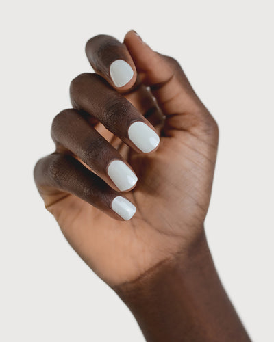 soft sage nail polish hand swatch on dark skin tone