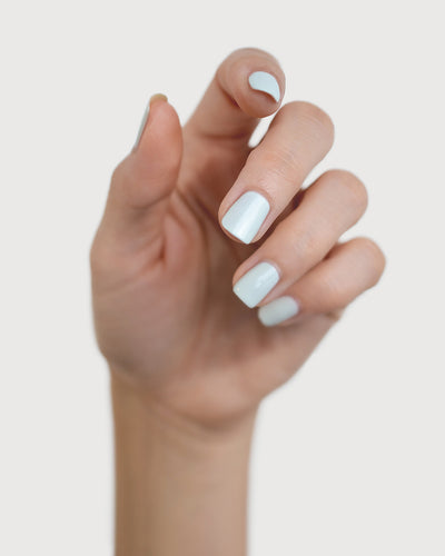soft sage nail polish hand swatch on fair skin tone