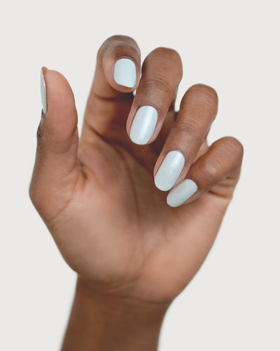 soft sage nail polish hand swatch on medium skin tone