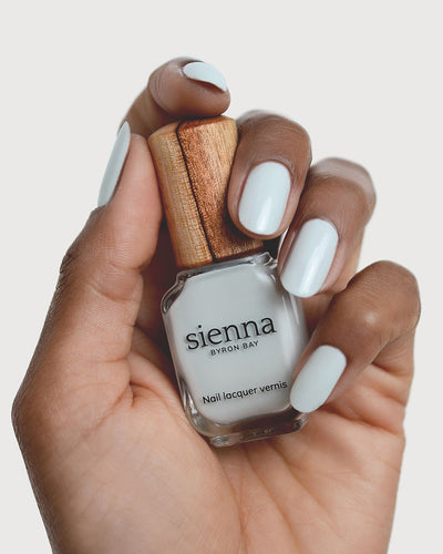 soft sage nail polish hand swatch on medium skin tone