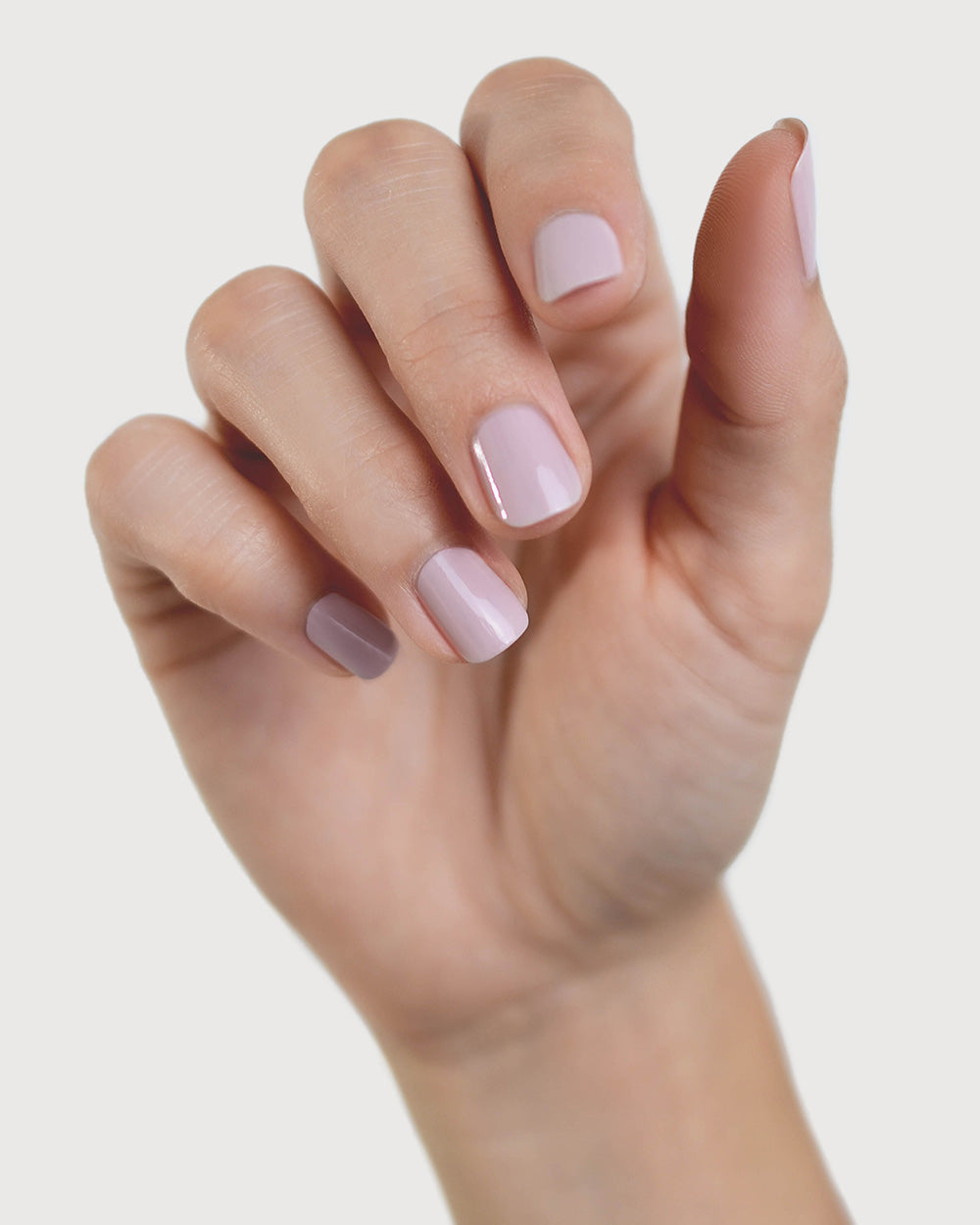Tranquility Light Mauve Rose Crème nail polish by Sienna Byron Bay on fair skin tone hand.