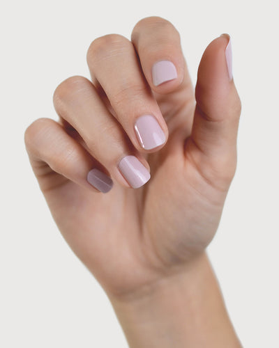 Tranquility Light Mauve Rose Crème nail polish by Sienna Byron Bay on fair skin tone hand.