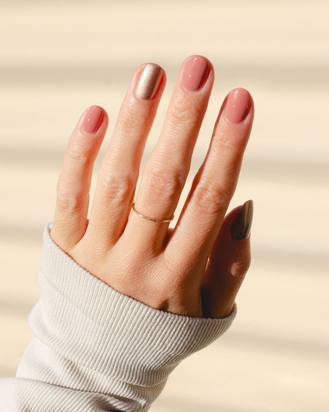 Rose brown with silver satin Glaze and Stony mauve nail polish painted on nails with Fair skin tone
